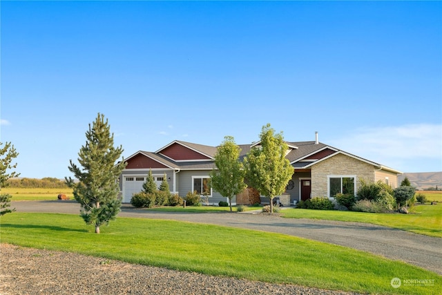 view of front facade with a garage and a front yard