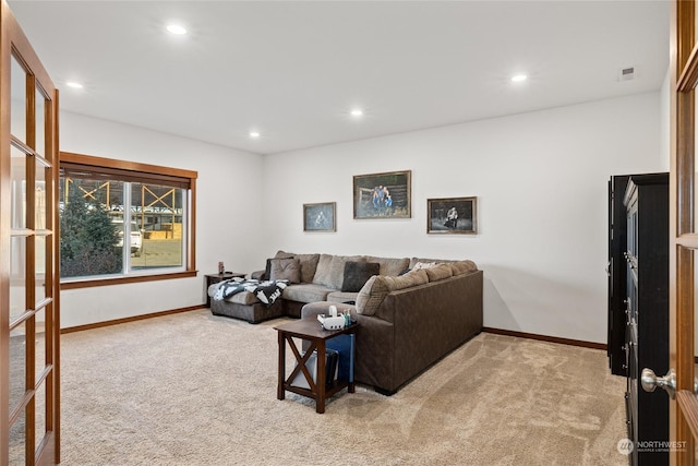 living room with light colored carpet and french doors