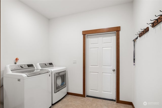 laundry room featuring washing machine and clothes dryer