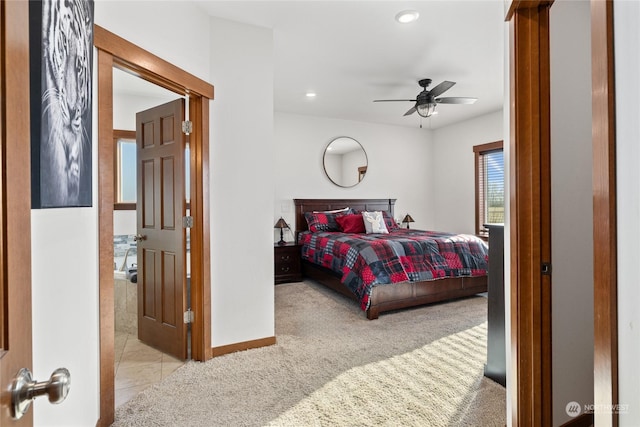 bedroom with light colored carpet and ceiling fan