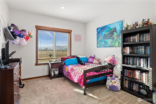 bedroom with light colored carpet