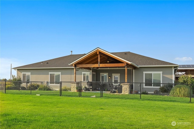 back of house featuring a yard