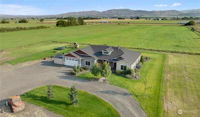 bird's eye view with a mountain view and a rural view