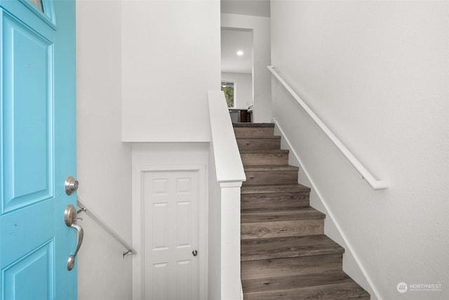 staircase featuring hardwood / wood-style floors