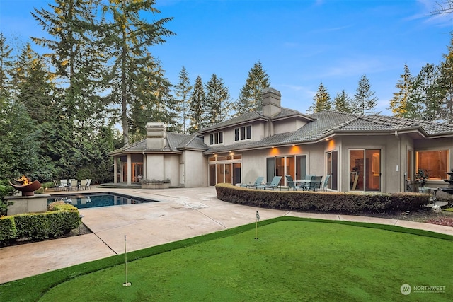 rear view of house with a patio