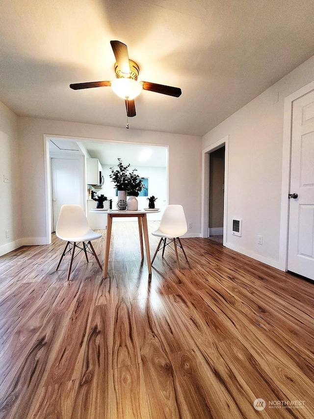 unfurnished room with ceiling fan and light wood-type flooring