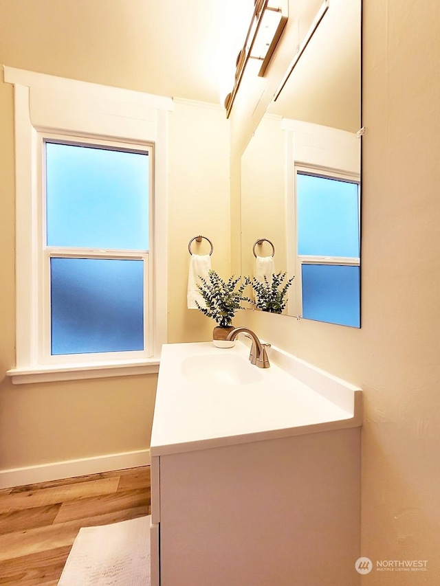 bathroom featuring vanity and hardwood / wood-style flooring