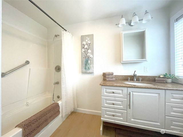 375 Union Ave SE Unit 125, Renton, WA 98059 - bathroom with vanity, shower / bath combo with shower curtain, and wood finished floors