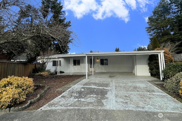 ranch-style home with a carport