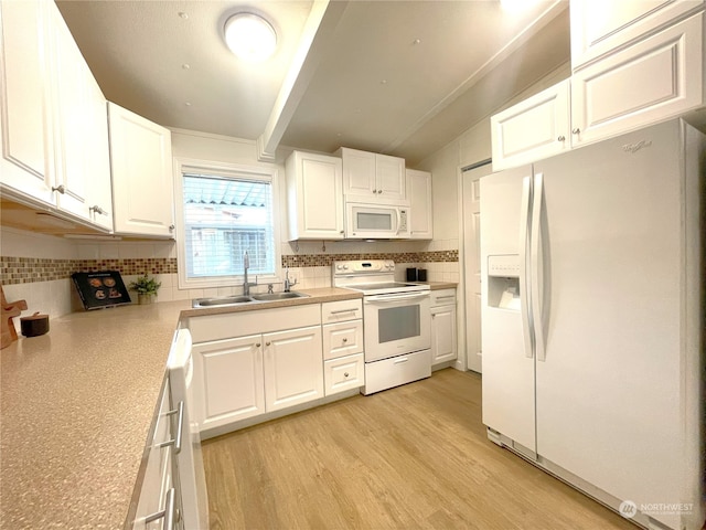 kitchen featuring sink, white appliances, white cabinetry, backsplash, and light hardwood / wood-style floors