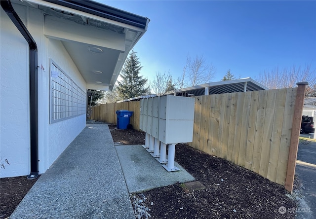 view of property exterior with a mail area