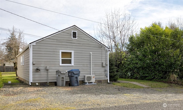 view of side of property featuring ac unit