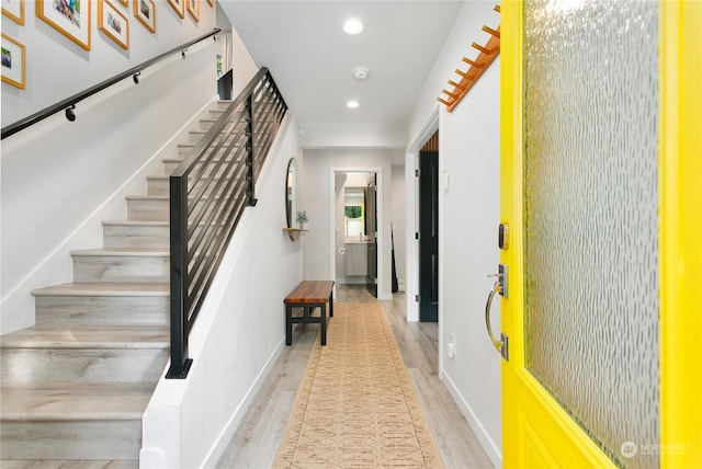 staircase with wood-type flooring