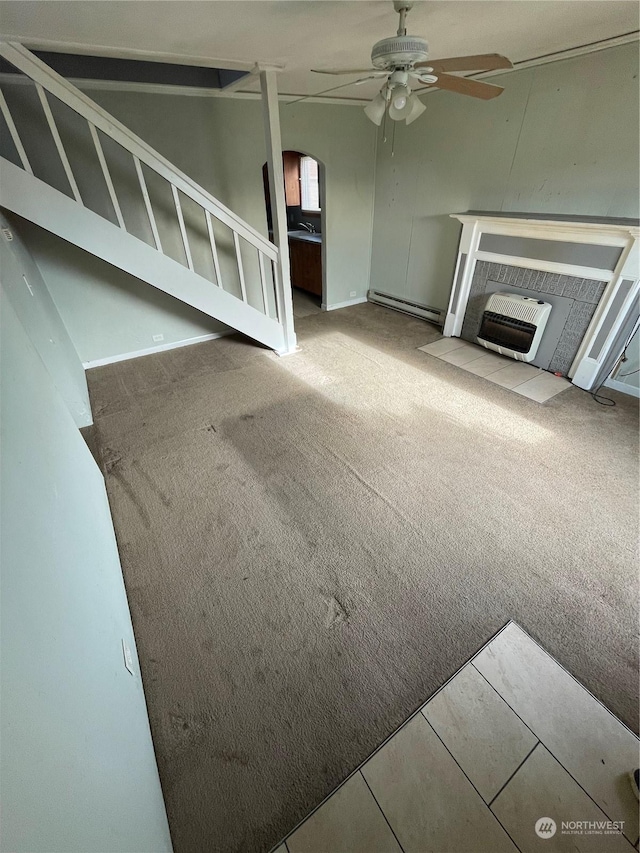 unfurnished living room with ceiling fan, carpet, heating unit, and baseboard heating