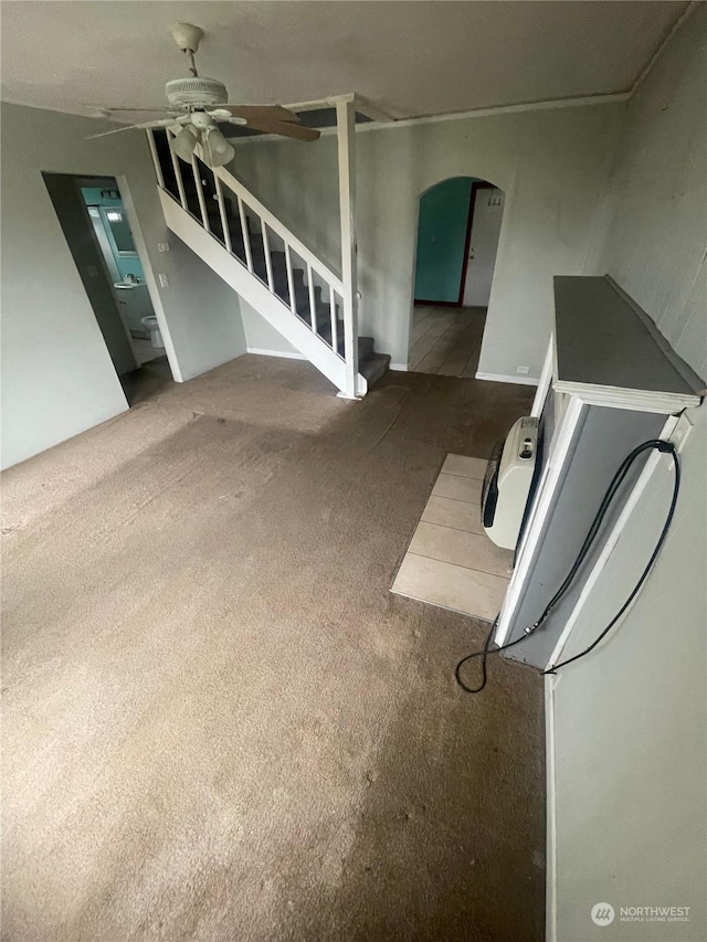 kitchen featuring ceiling fan and carpet flooring