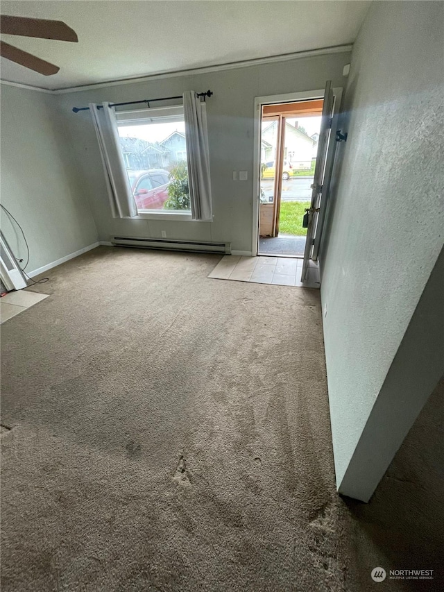 interior space featuring baseboard heating and light carpet