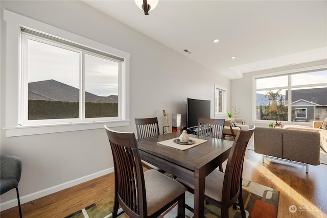 dining area with recessed lighting, wood finished floors, visible vents, and baseboards