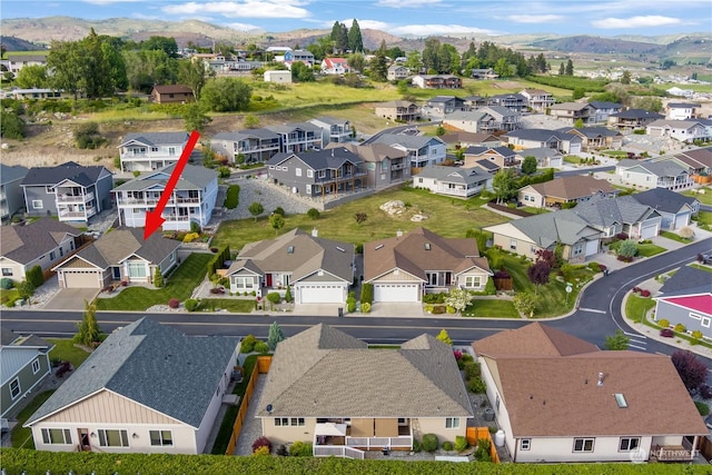 birds eye view of property with a residential view and a mountain view