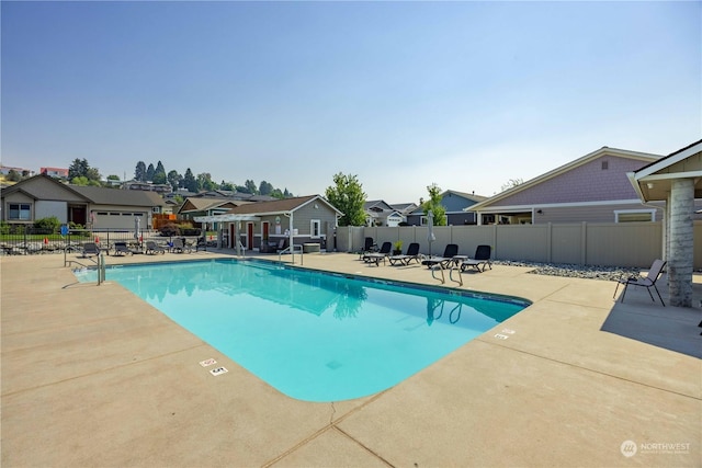 view of swimming pool with a patio