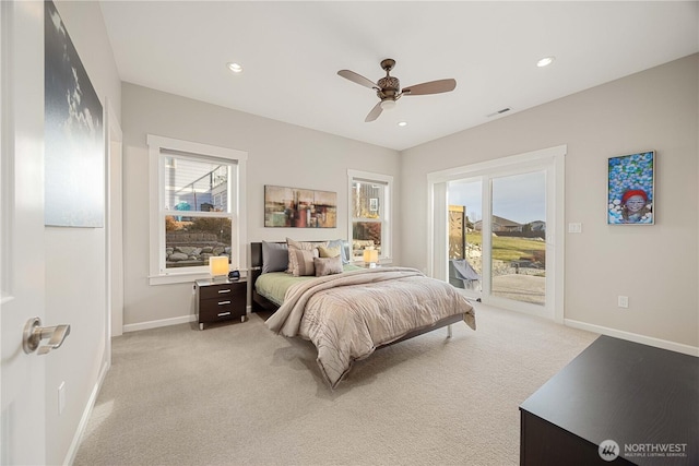 bedroom with access to exterior, multiple windows, baseboards, and light colored carpet