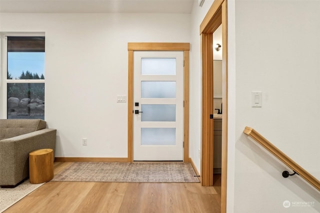 doorway to outside with hardwood / wood-style floors