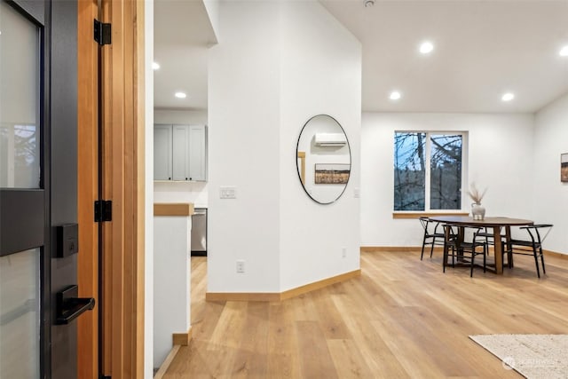 hall with light hardwood / wood-style flooring