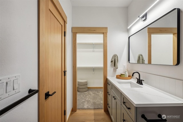 bathroom featuring vanity and hardwood / wood-style flooring