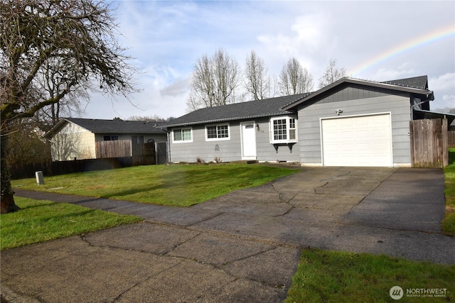 single story home featuring a garage, driveway, fence, and a front yard