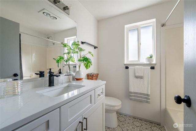 full bathroom featuring vanity, tile patterned flooring, toilet, and washtub / shower combination