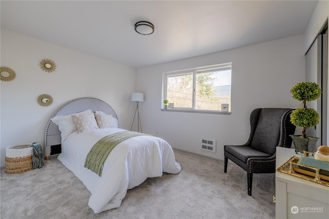 bedroom with light colored carpet