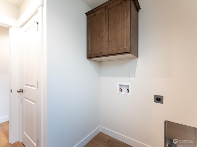 washroom with cabinets, washer hookup, light hardwood / wood-style flooring, and electric dryer hookup