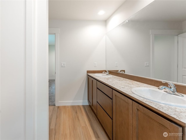 bathroom featuring vanity and hardwood / wood-style floors