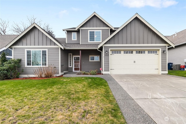 view of front facade featuring central AC unit, a garage, and a front lawn