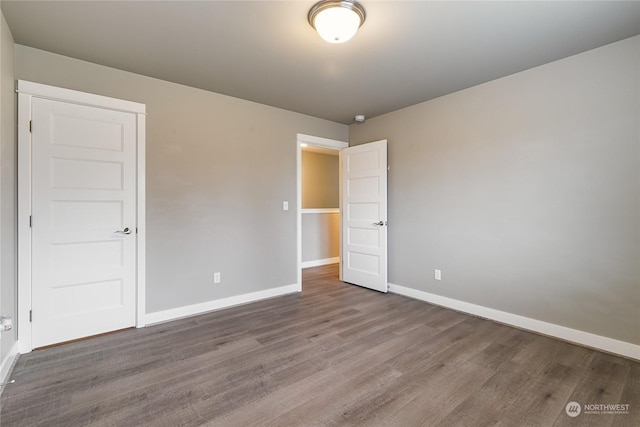 unfurnished bedroom featuring hardwood / wood-style flooring