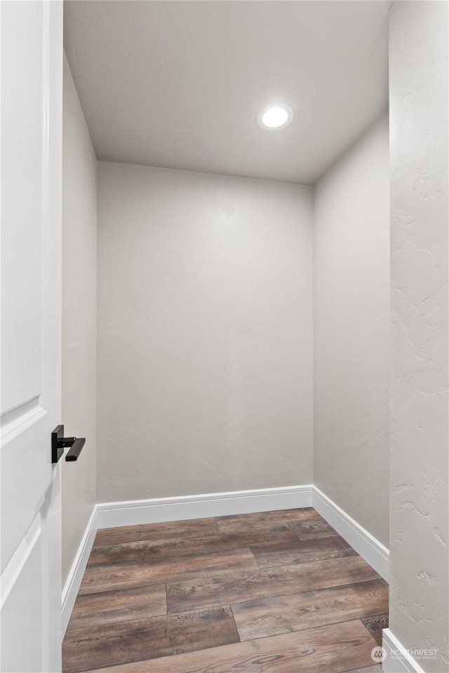 empty room featuring dark hardwood / wood-style flooring