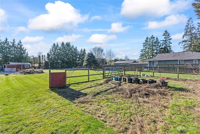 view of yard with a rural view