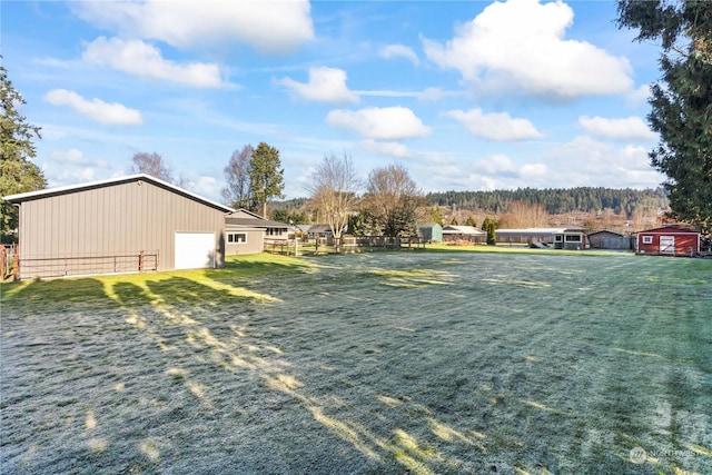 view of yard with an outbuilding and a garage