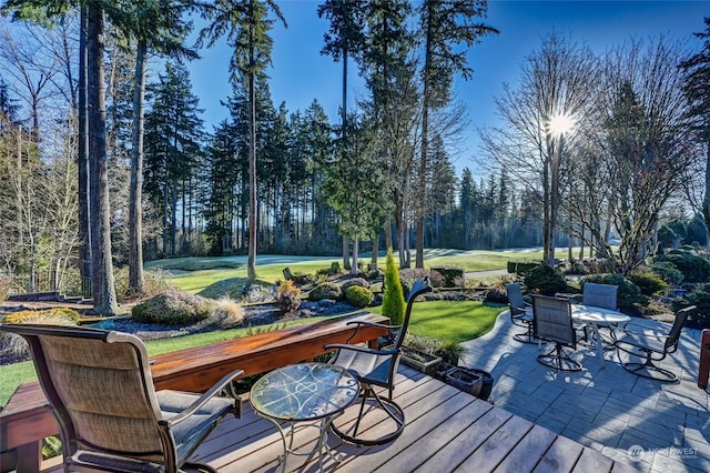 wooden deck with a lawn