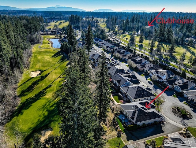 birds eye view of property featuring a water and mountain view