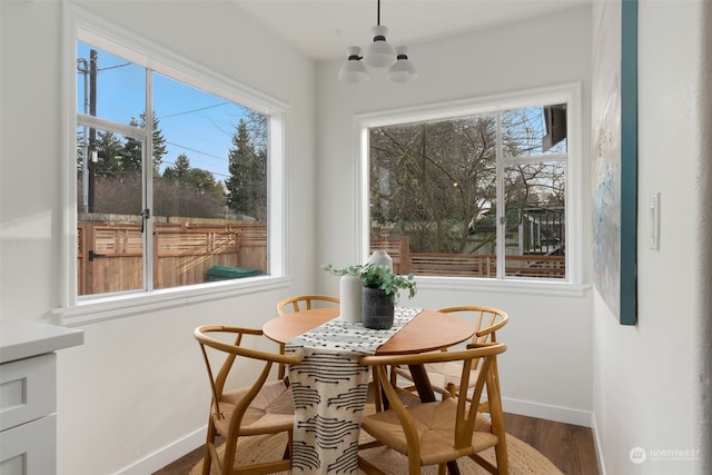 dining room with an inviting chandelier and hardwood / wood-style floors