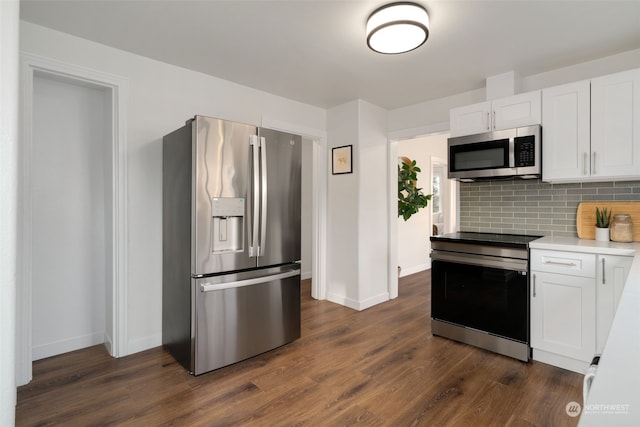 kitchen with backsplash, appliances with stainless steel finishes, dark hardwood / wood-style floors, and white cabinets