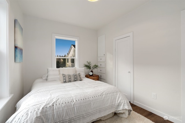 bedroom featuring dark hardwood / wood-style flooring