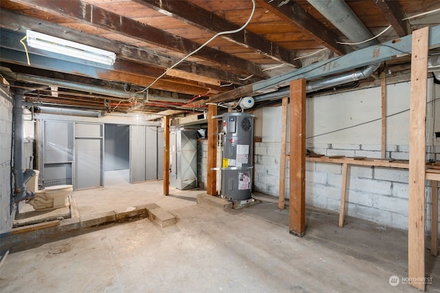 basement featuring strapped water heater and heating unit