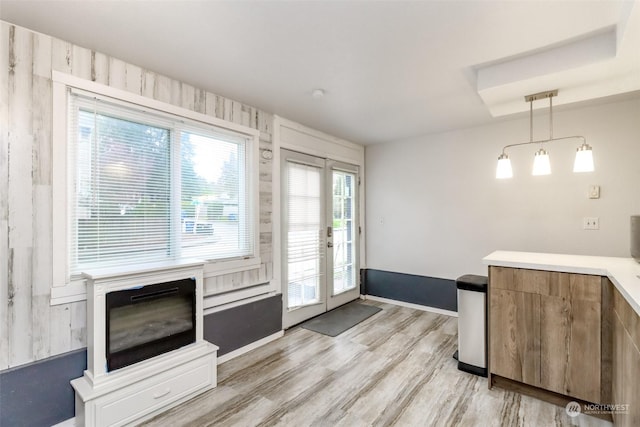 doorway to outside with french doors and light wood-type flooring