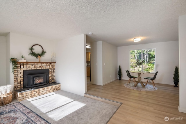 interior space featuring a textured ceiling and light hardwood / wood-style flooring