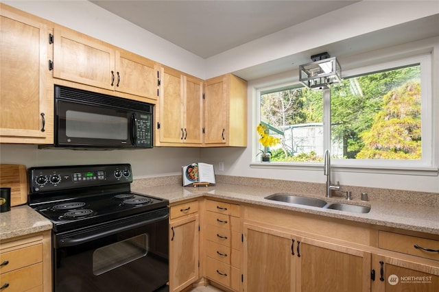 kitchen with sink, light brown cabinets, and black appliances