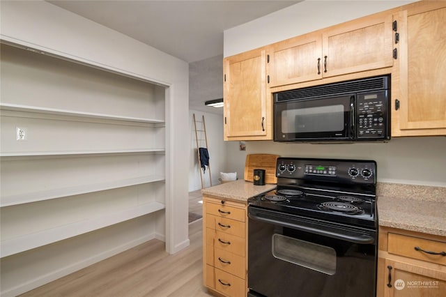 kitchen with light stone countertops, black appliances, and light brown cabinets