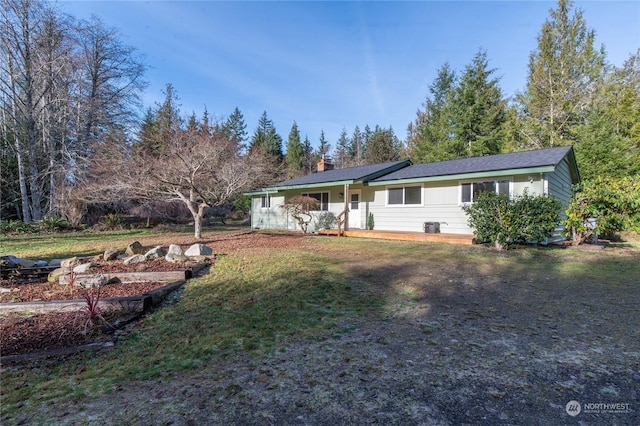 view of front of home with a porch and a front lawn