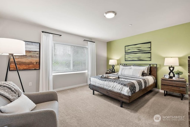 carpeted bedroom featuring baseboards