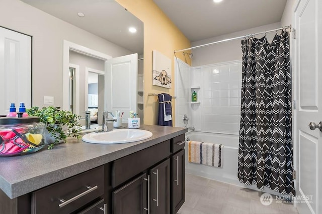 bathroom with shower / bath combo and vanity